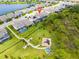 Aerial view showing the property close to the community playground, lake and green space, perfect for families at 11105 Balfour E St, Venice, FL 34293