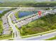 Aerial view of the community showcasing the home's location near a lake and green spaces at 11105 Balfour E St, Venice, FL 34293