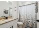Bathroom features a granite countertop, integrated sink and black hardware fixtures at 11105 Balfour E St, Venice, FL 34293