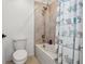 Bathroom features a tub with tiled wall surround and shower and a modern commode at 11105 Balfour E St, Venice, FL 34293