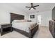 Comfortable bedroom featuring a ceiling fan and complemented by neutral decor and soft carpeting at 11105 Balfour E St, Venice, FL 34293
