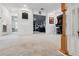 Spacious bonus room with carpet and entertainment area featuring arcade game and lounge seating at 11105 Balfour E St, Venice, FL 34293