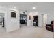 Bonus room with carpet, arcade game and doorway leading to another recreational space at 11105 Balfour E St, Venice, FL 34293