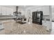 Modern kitchen with stainless steel appliances and granite countertops at 11105 Balfour E St, Venice, FL 34293