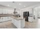 Spacious open kitchen with an island, stainless appliances and white cabinets at 11105 Balfour E St, Venice, FL 34293