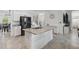 Bright kitchen island with granite countertop, stainless refrigerator, and stairs at 11105 Balfour E St, Venice, FL 34293