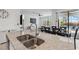 Kitchen island with view of living area, backyard and outdoor dining at 11105 Balfour E St, Venice, FL 34293