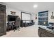 Home theater boasts large screen, custom lighting, media server and comfortable seating at 11105 Balfour E St, Venice, FL 34293