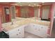 Large bathroom vanity with an oversized mirror, vanity lighting, and marble countertop at 1128 Rum Cay Ct, Punta Gorda, FL 33950