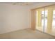 A bright bedroom with sliding glass doors leading to the outdoor pool and patio at 1128 Rum Cay Ct, Punta Gorda, FL 33950