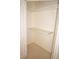 A simple closet with shelves and hanging rods, providing ample storage space at 1128 Rum Cay Ct, Punta Gorda, FL 33950