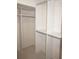 A custom-built closet with rods and shelving offering many storage options at 1128 Rum Cay Ct, Punta Gorda, FL 33950