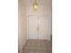 Foyer with tile floors and double-door closet at 1128 Rum Cay Ct, Punta Gorda, FL 33950