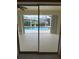 Covered lanai with a view of the swimming pool and canal through the sliding glass doors at 1128 Rum Cay Ct, Punta Gorda, FL 33950