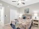 Cozy bedroom with beach themed decor, wicker headboard, ceiling fan, and closet at 14081 Heritage Landing Blvd # 214, Punta Gorda, FL 33955