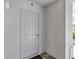 Exterior shot of gray door leading to apartment unit at 14081 Heritage Landing Blvd # 214, Punta Gorda, FL 33955