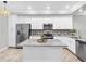Modern kitchen with stainless steel appliances, granite countertops, and ample cabinet space at 14081 Heritage Landing Blvd # 214, Punta Gorda, FL 33955