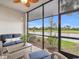 Relaxing screened-in lanai with water views and comfortable seating at 14081 Heritage Landing Blvd # 214, Punta Gorda, FL 33955