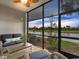Relaxing screened-in lanai with water views and comfortable seating at 14081 Heritage Landing Blvd # 214, Punta Gorda, FL 33955