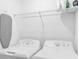 Bright laundry room with full-size washer and dryer, and a wire shelving unit at 14081 Heritage Landing Blvd # 214, Punta Gorda, FL 33955