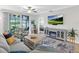 Comfortable living room with golf course view, TV, and stylish furniture at 14081 Heritage Landing Blvd # 214, Punta Gorda, FL 33955