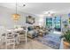 Cozy living room with a comfortable sectional sofa, stylish decor, and a view of the outdoors at 14081 Heritage Landing Blvd # 214, Punta Gorda, FL 33955