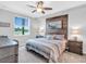 Serene main bedroom with view, wood accent wall, and soft lighting at 14081 Heritage Landing Blvd # 214, Punta Gorda, FL 33955