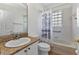 Functional bathroom with a tub/shower combo, granite vanity, and glass block window at 1605 Palace Ct, Punta Gorda, FL 33980