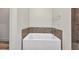 Close up of bathtub with tile surround at 16848 Canopy Garden Dr, Port Charlotte, FL 33953
