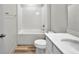 Bathroom featuring a shower-tub combo, tile surround, and vanity with drawers at 16848 Canopy Garden Dr, Port Charlotte, FL 33953