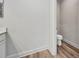 Powder room featuring toilet, vanity, and hardwood floors at 16848 Canopy Garden Dr, Port Charlotte, FL 33953