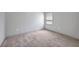 Bedroom featuring neutral walls, carpet flooring, and a window at 16848 Canopy Garden Dr, Port Charlotte, FL 33953