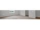 Spacious bedroom with plush carpet, neutral walls, and walk-in closet access at 16848 Canopy Garden Dr, Port Charlotte, FL 33953