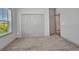 Bedroom showcasing large closet and view to outside at 16848 Canopy Garden Dr, Port Charlotte, FL 33953