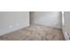 Bright bedroom with neutral walls, plush carpet, and plenty of natural light at 16848 Canopy Garden Dr, Port Charlotte, FL 33953