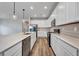 Spacious kitchen with stainless steel appliances, white cabinetry, and a large island at 16848 Canopy Garden Dr, Port Charlotte, FL 33953