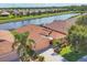 Aerial perspective of the property highlighting its lakeside location and community setting at 1775 Scarlett Ave, North Port, FL 34289