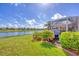 Beautiful backyard and lake view with a screened-in patio at 1775 Scarlett Ave, North Port, FL 34289