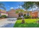 Charming single-story home with well-manicured lawn, mature trees and inviting curb appeal at 1775 Scarlett Ave, North Port, FL 34289
