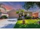 Charming single-story home with well-manicured lawn, mature trees and inviting curb appeal at 1775 Scarlett Ave, North Port, FL 34289