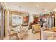 Bright eat-in kitchen featuring stainless appliances, granite countertops, breakfast table, and sliding glass doors at 1775 Scarlett Ave, North Port, FL 34289