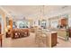 Open-concept kitchen featuring a breakfast bar, pendant lighting and seamless flow to the living area at 1775 Scarlett Ave, North Port, FL 34289