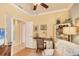 Office with desk, shelves, and neutral colors; adjacent to a doorway with natural light at 1775 Scarlett Ave, North Port, FL 34289