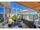 Relax on this covered lanai with a hot tub and a view of the water at 1775 Scarlett Ave, North Port, FL 34289