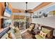 Relaxing sunroom with wicker furniture, a ceiling fan, and sliding glass doors to a patio at 1775 Scarlett Ave, North Port, FL 34289
