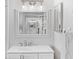 Bathroom vanity showcasing a decorative mirror that offers a reflection of the other side of the bathroom at 19505 Quesada Ave # Vv201, Port Charlotte, FL 33948