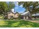 Community center and pool with mature landscaping at 19505 Quesada Ave # Vv201, Port Charlotte, FL 33948