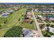 View of houses with golf course, waterways and tropical landscaping at 2105 Deborah Dr, Punta Gorda, FL 33950