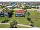 Overhead view of property with tile roof, screened-in pool, set amidst lush landscaping and a well manicured lawn at 2105 Deborah Dr, Punta Gorda, FL 33950