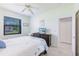 Bedroom with a view and a dresser with a TV at 2105 Deborah Dr, Punta Gorda, FL 33950